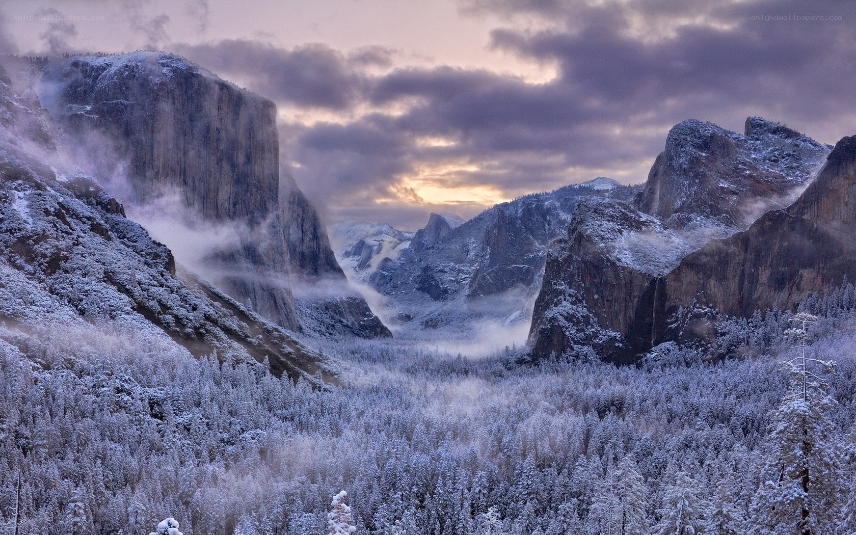 Snowy mountain valley at dawn