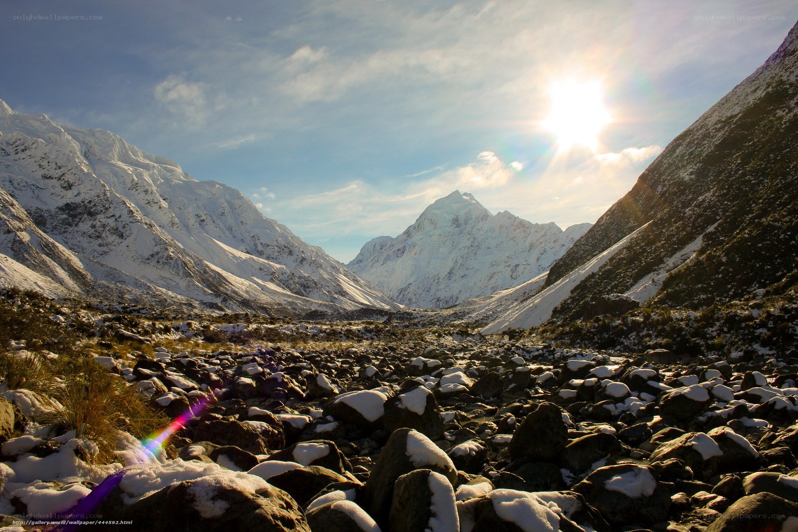 Snowy mountain valley at sunrise
