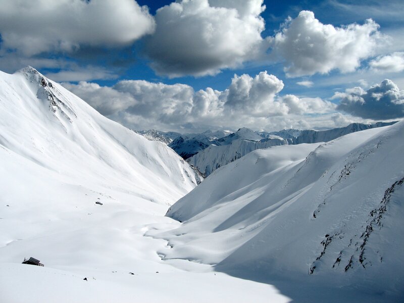 Snowy mountain valley landscape