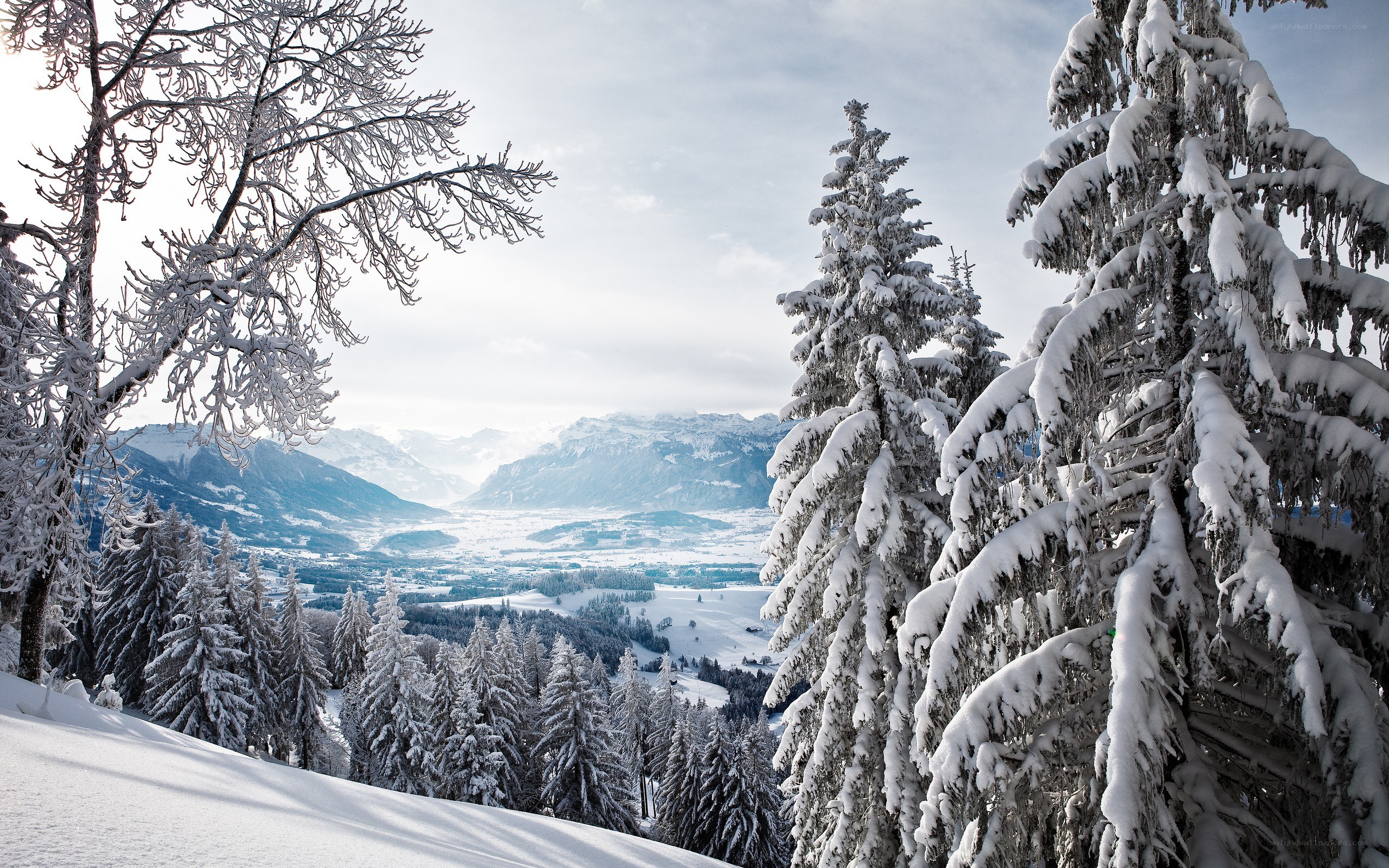 Snowy mountain valley landscape