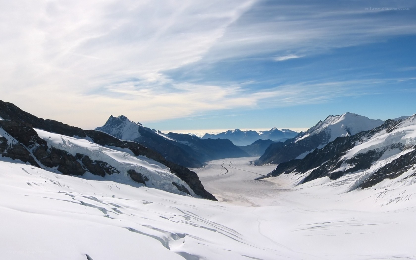 snowy mountain valley with glacier