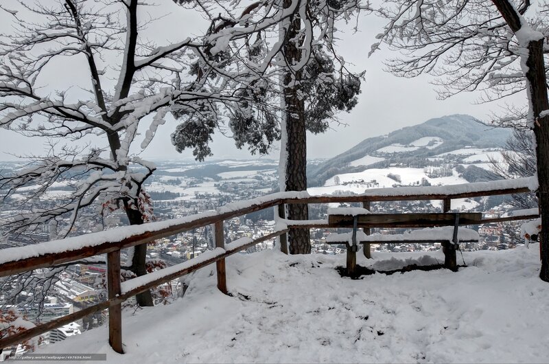 Snowy mountain view from bench