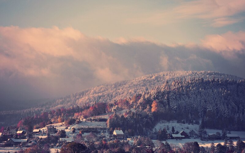Snowy mountain village at dawn