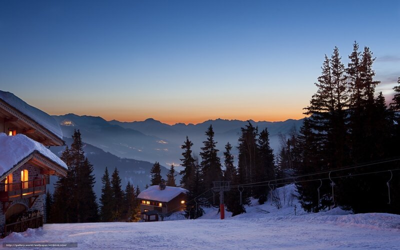 Snowy mountain village at dusk