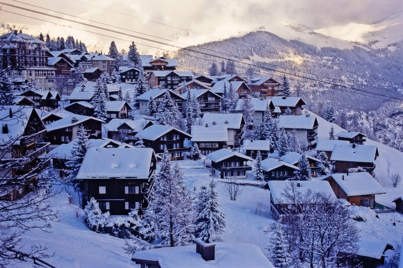 Snowy mountain village at dusk