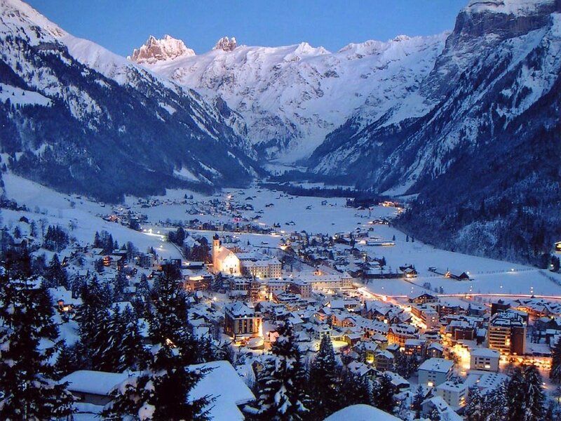 snowy mountain village at dusk