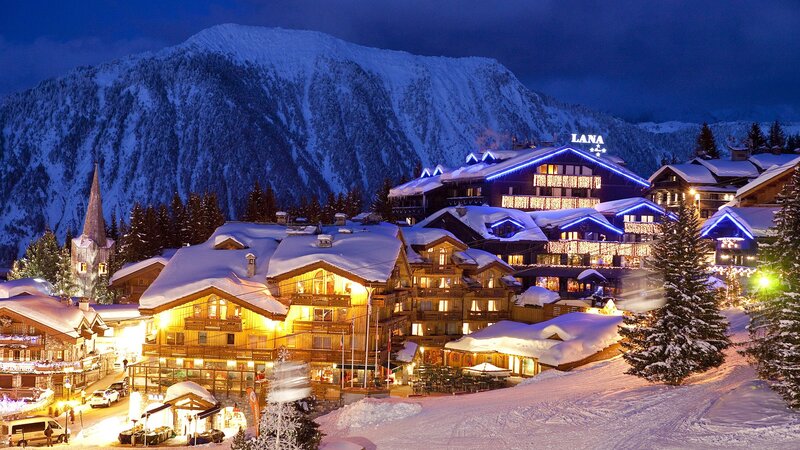Snowy mountain village at night