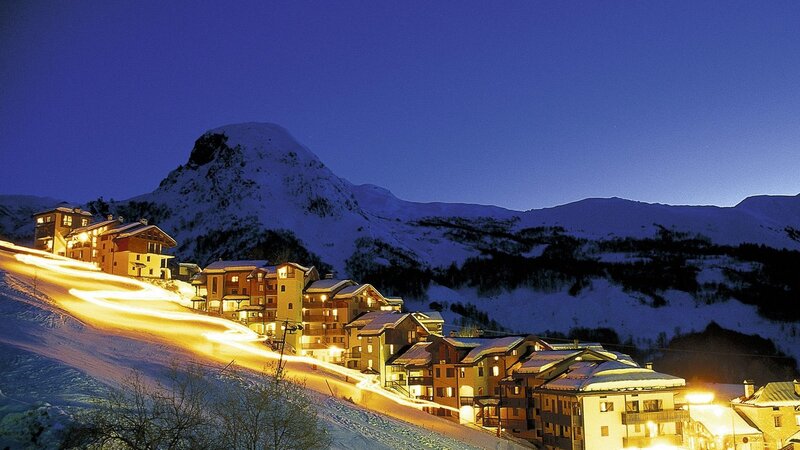 snowy mountain village at night
