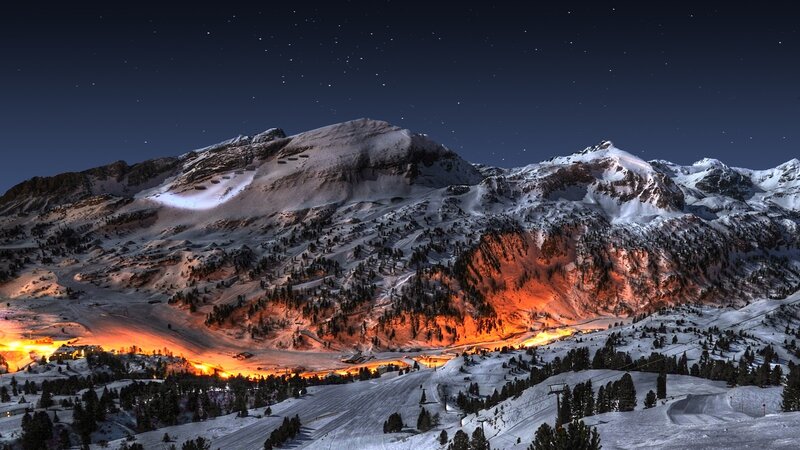 snowy mountain village at night