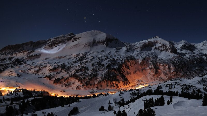 snowy mountain village at night