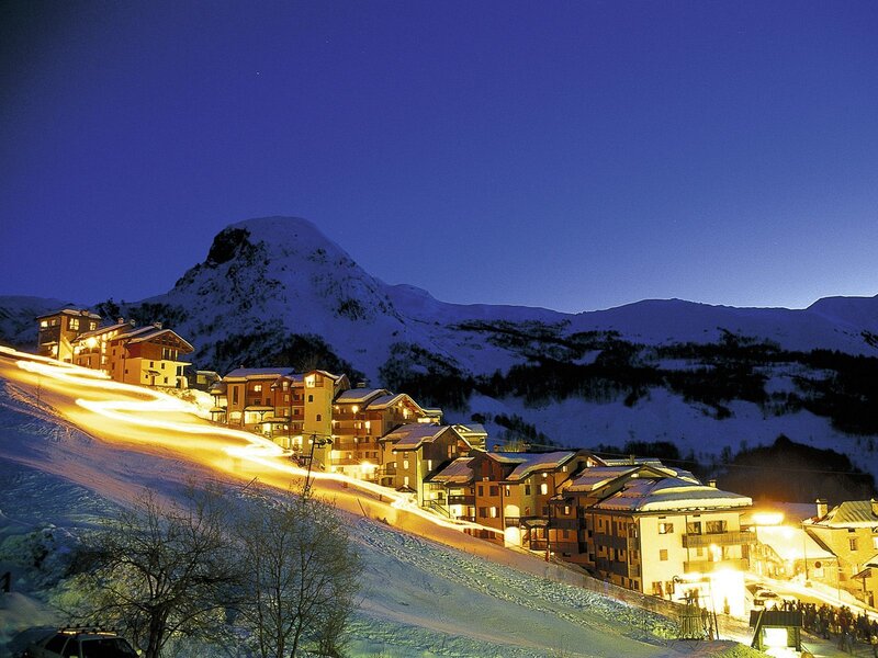 Snowy mountain village at night