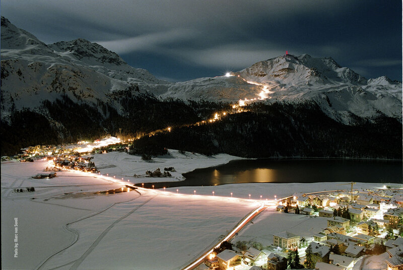 Snowy mountain village at night