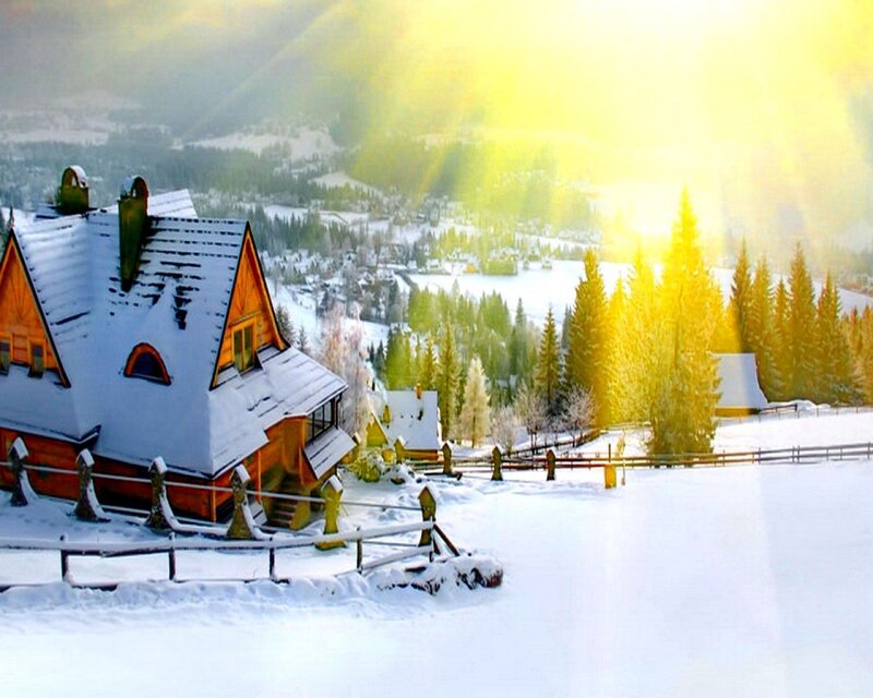 Snowy mountain village at sunrise