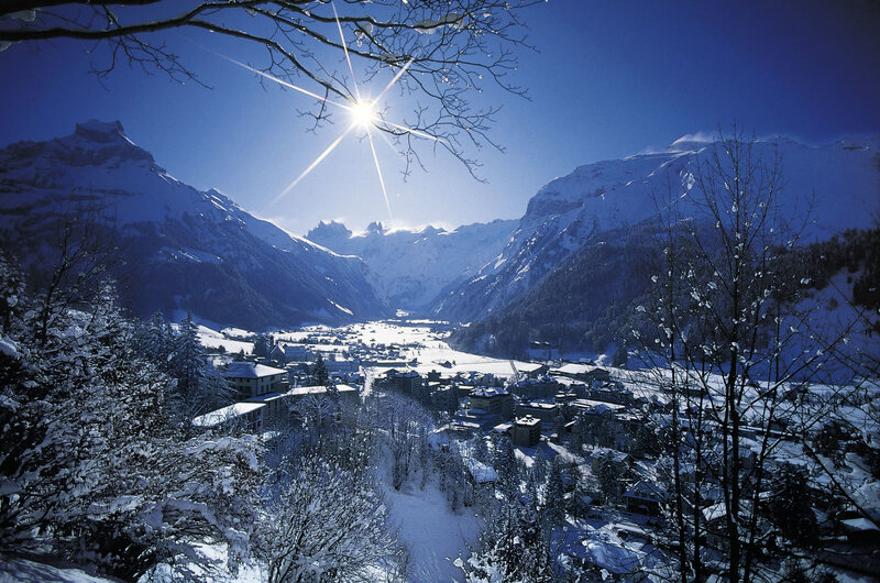 Snowy mountain village at sunrise