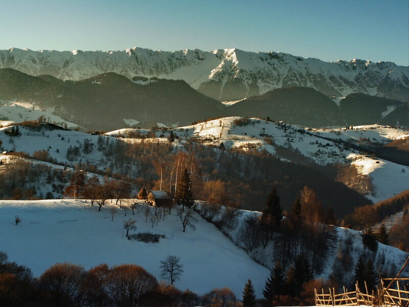 Snowy mountain village at sunrise