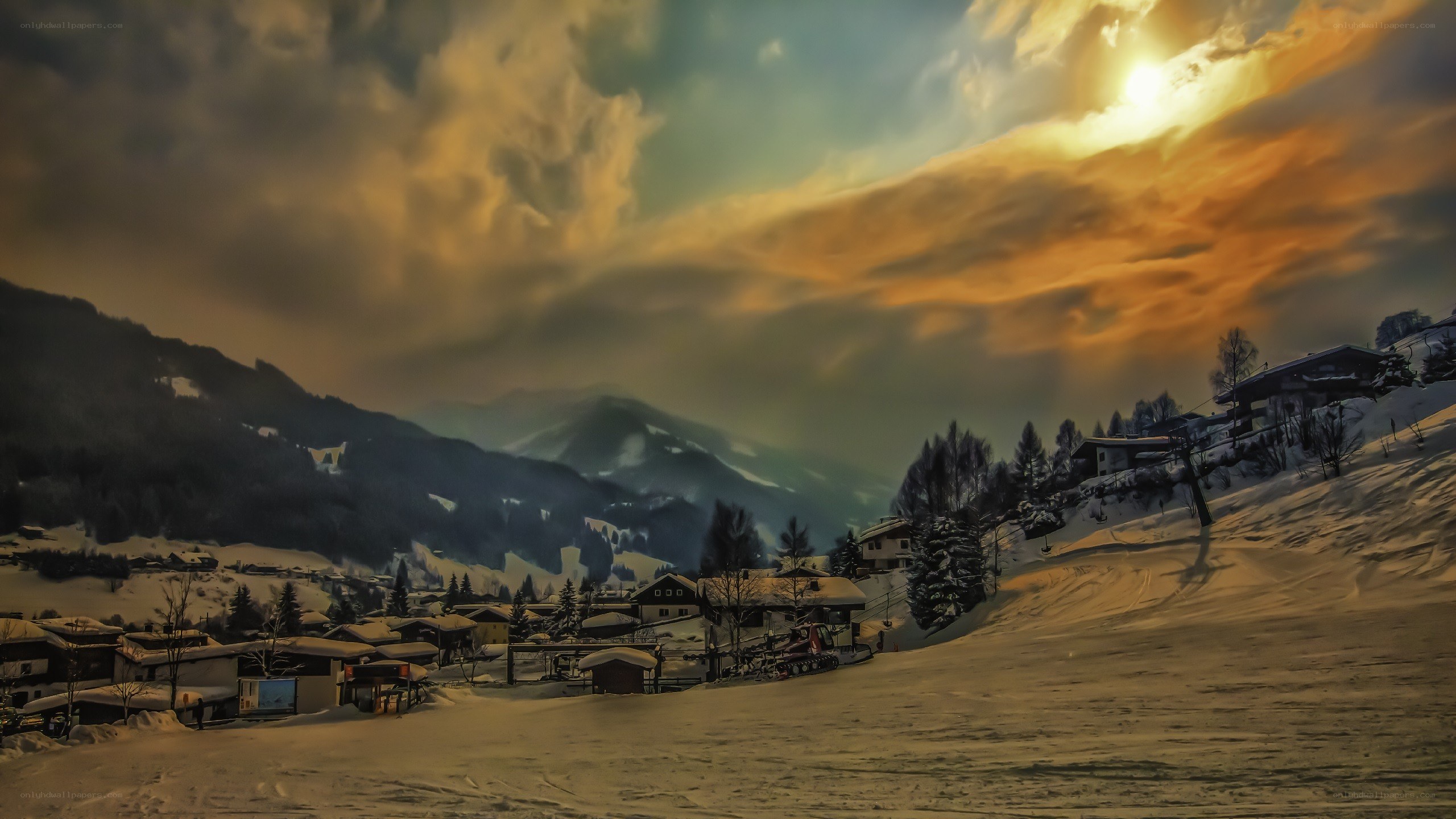 Snowy mountain village at sunset