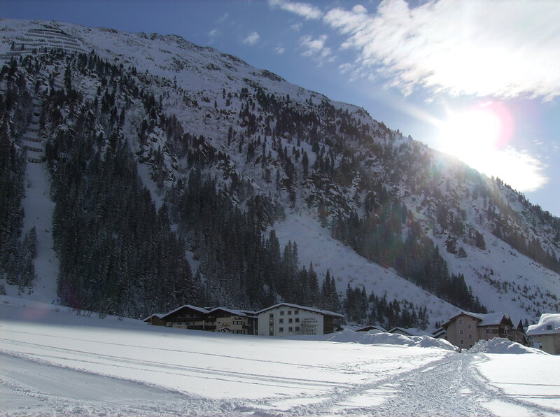 Snowy mountain village with hotel
