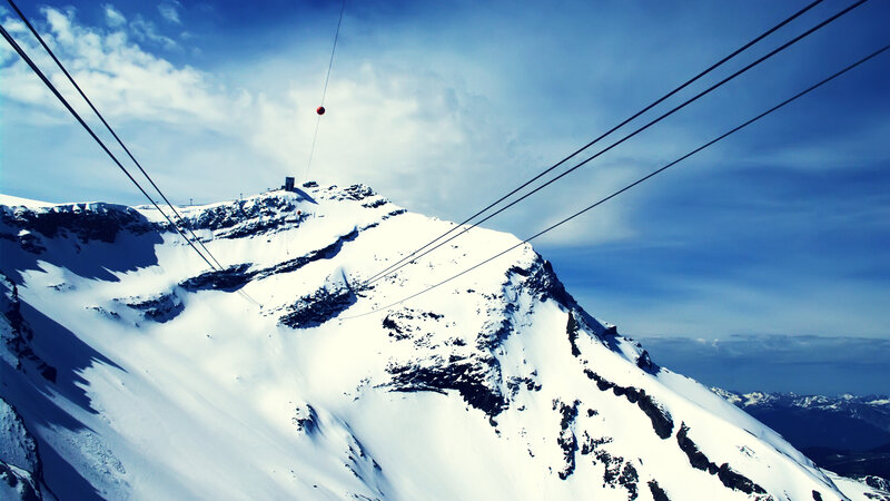 Snowy mountain with cable car