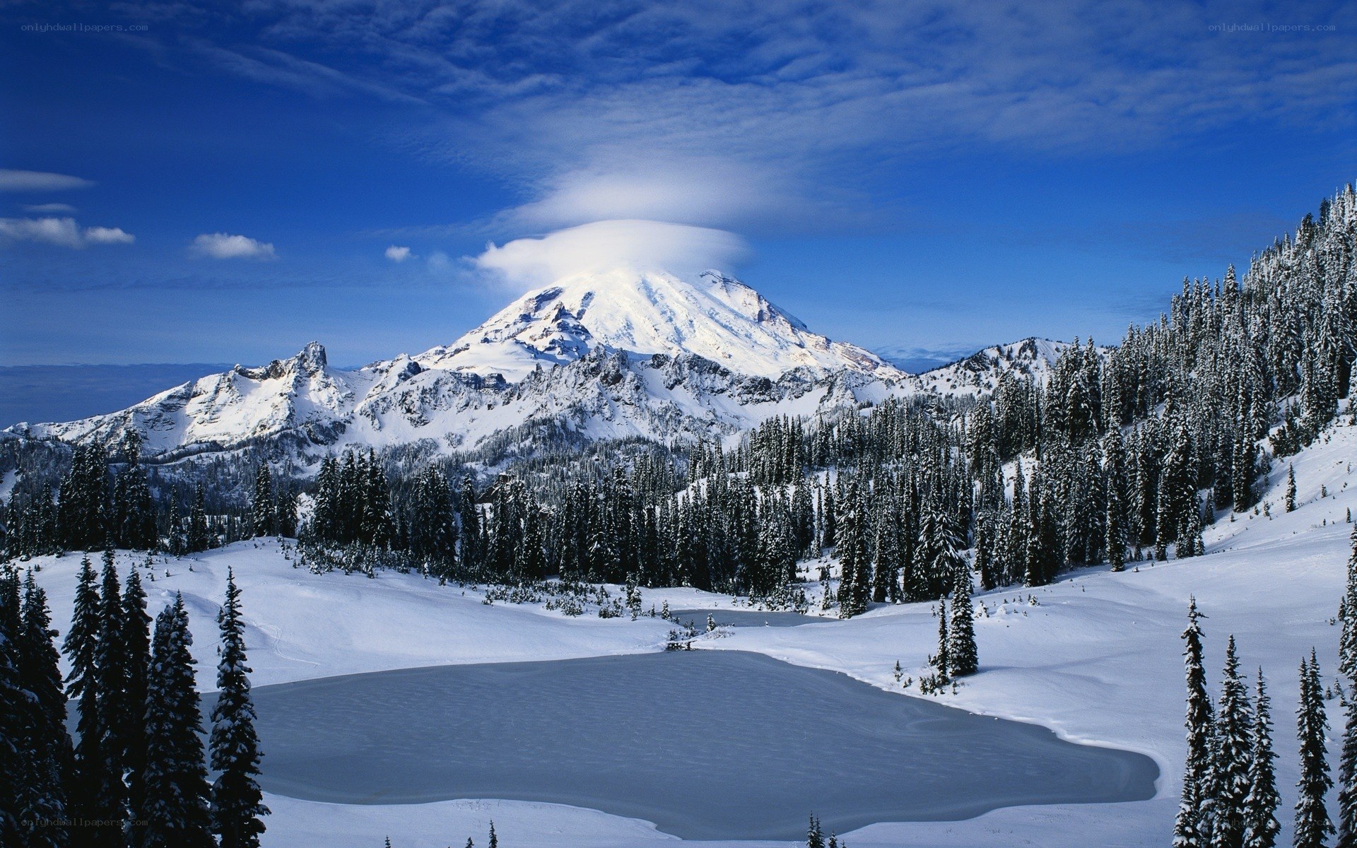 Snowy mountain with cloud cap