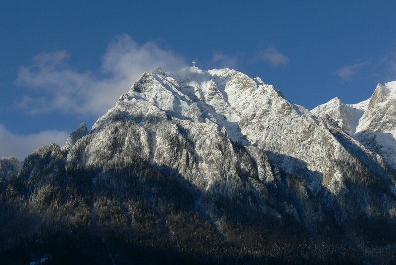 Snowy mountain with cross