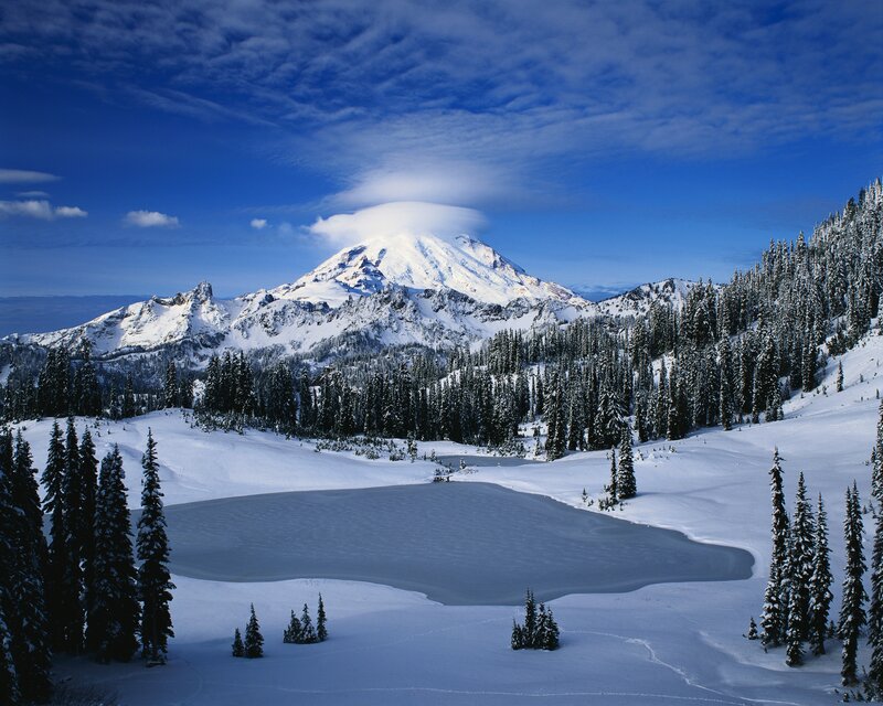 Snowy mountain with frozen lake