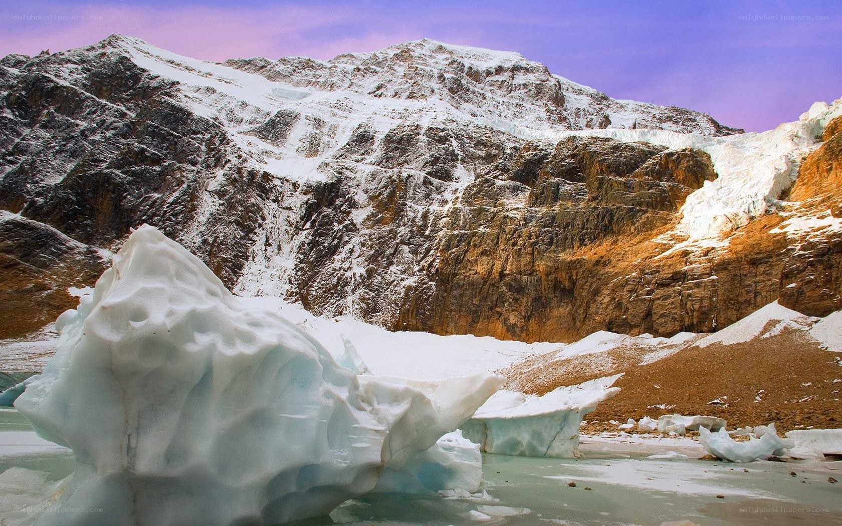 Snowy mountain with icebergs