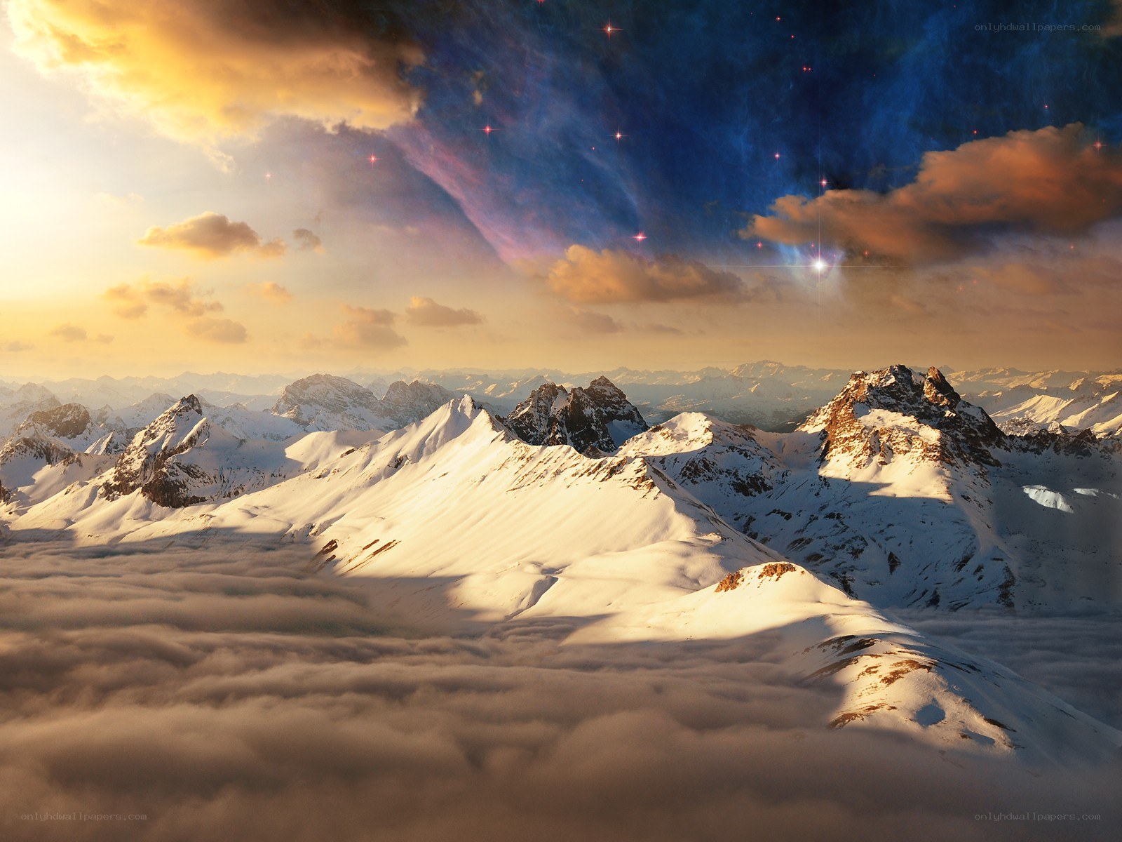 Snowy mountains above clouds