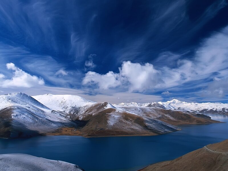 Snowy mountains and blue lake