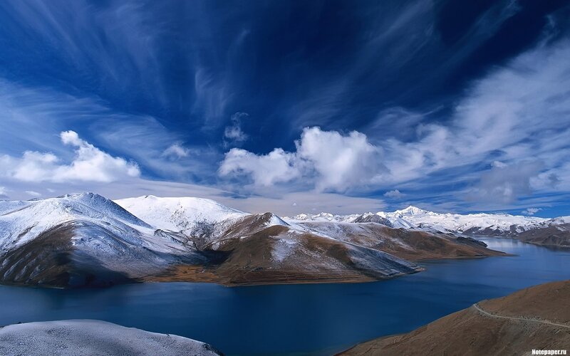 Snowy mountains and blue lake