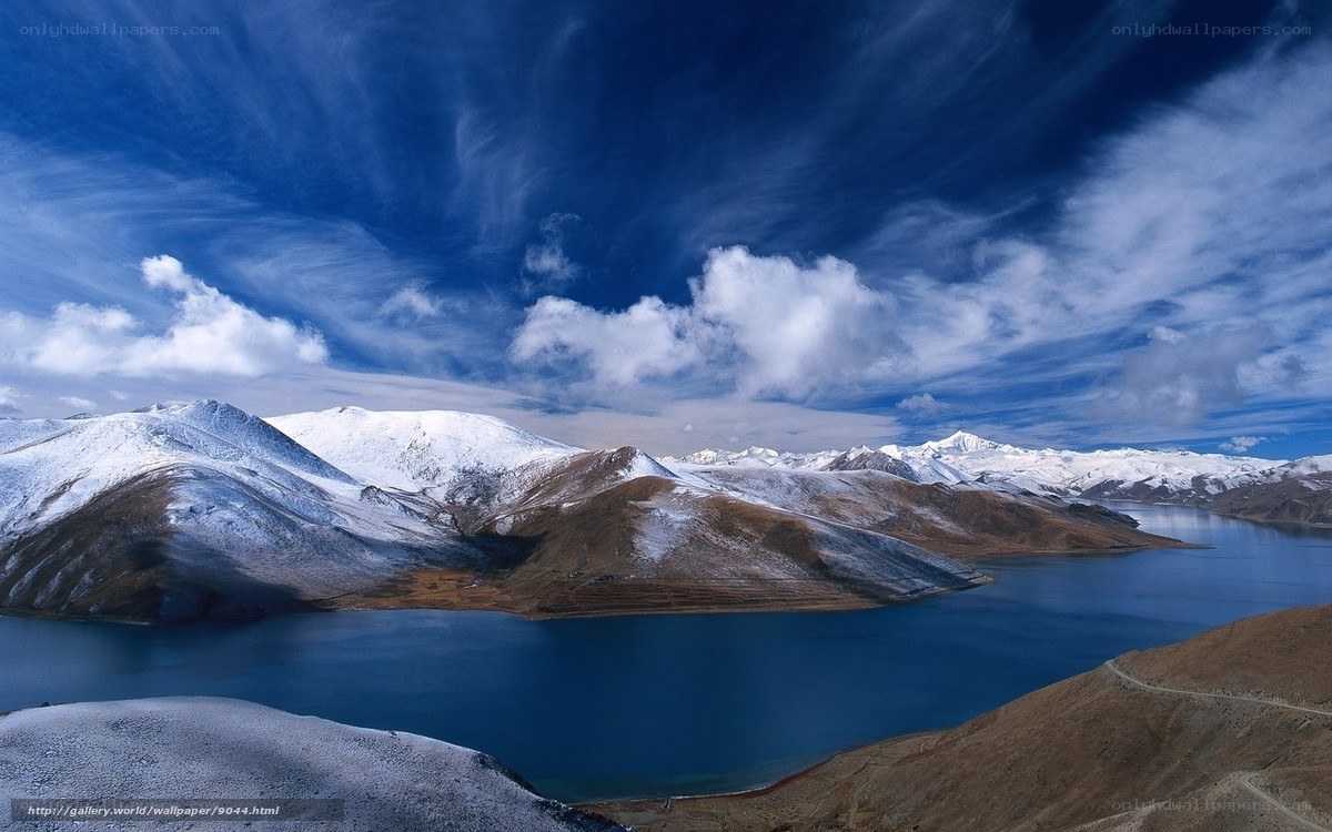 Snowy mountains and blue lake