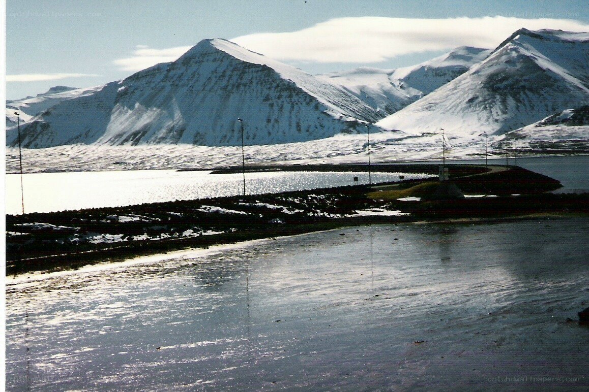 snowy mountains and coastal landscape