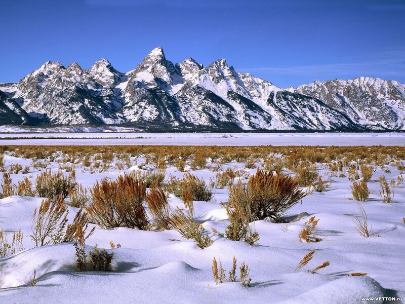 Snowy mountains and frozen lake