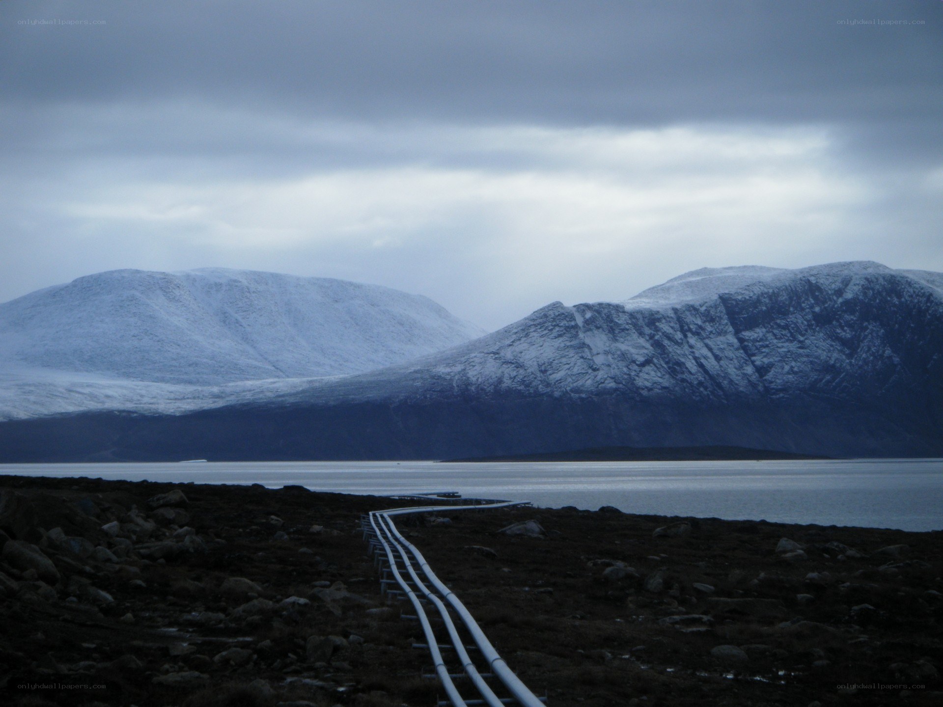 Snowy mountains and pipeline