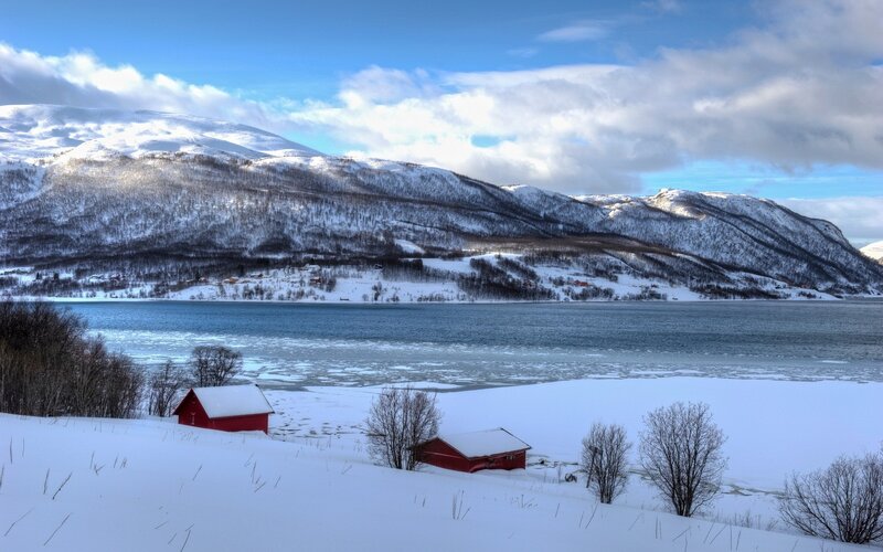 Snowy mountains and red cabins