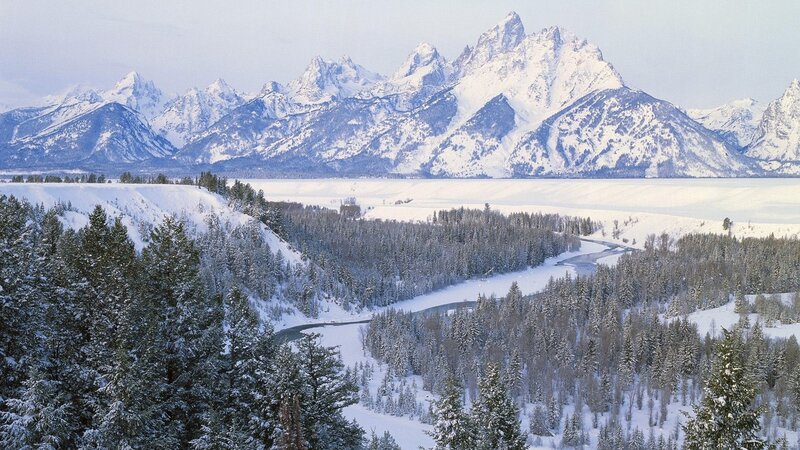 Snowy mountains and river valley