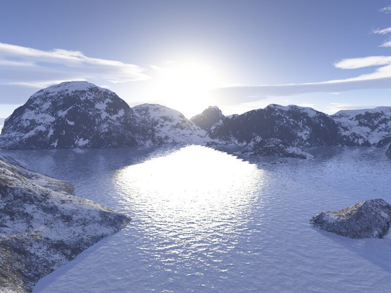 Snowy mountains and sunlit water