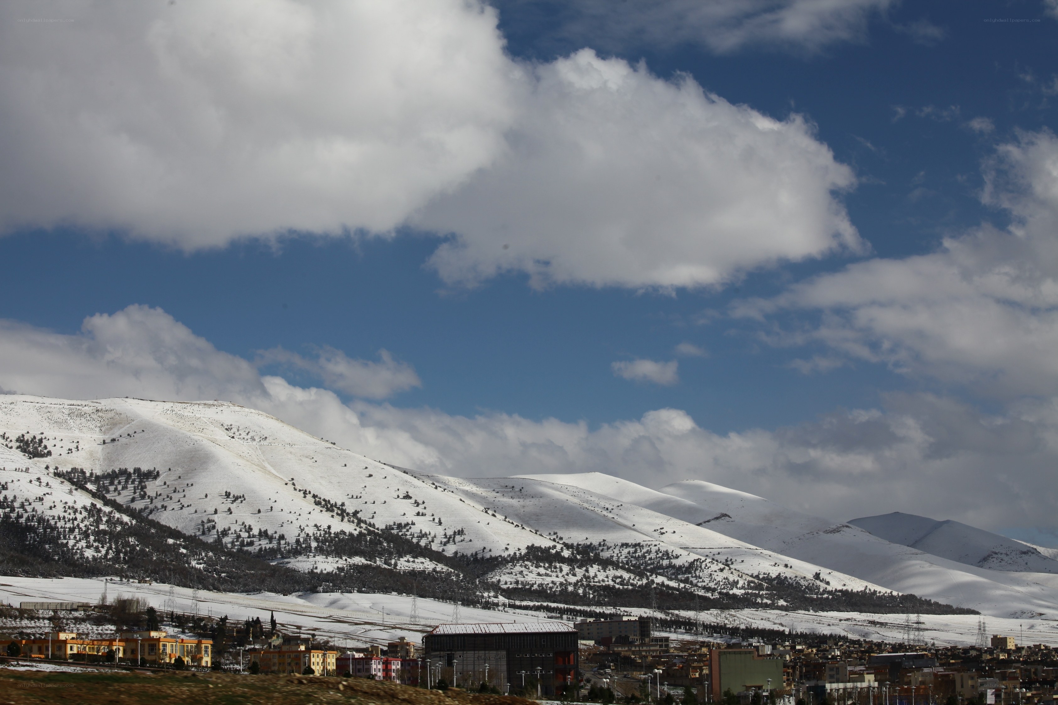 Snowy mountains and town
