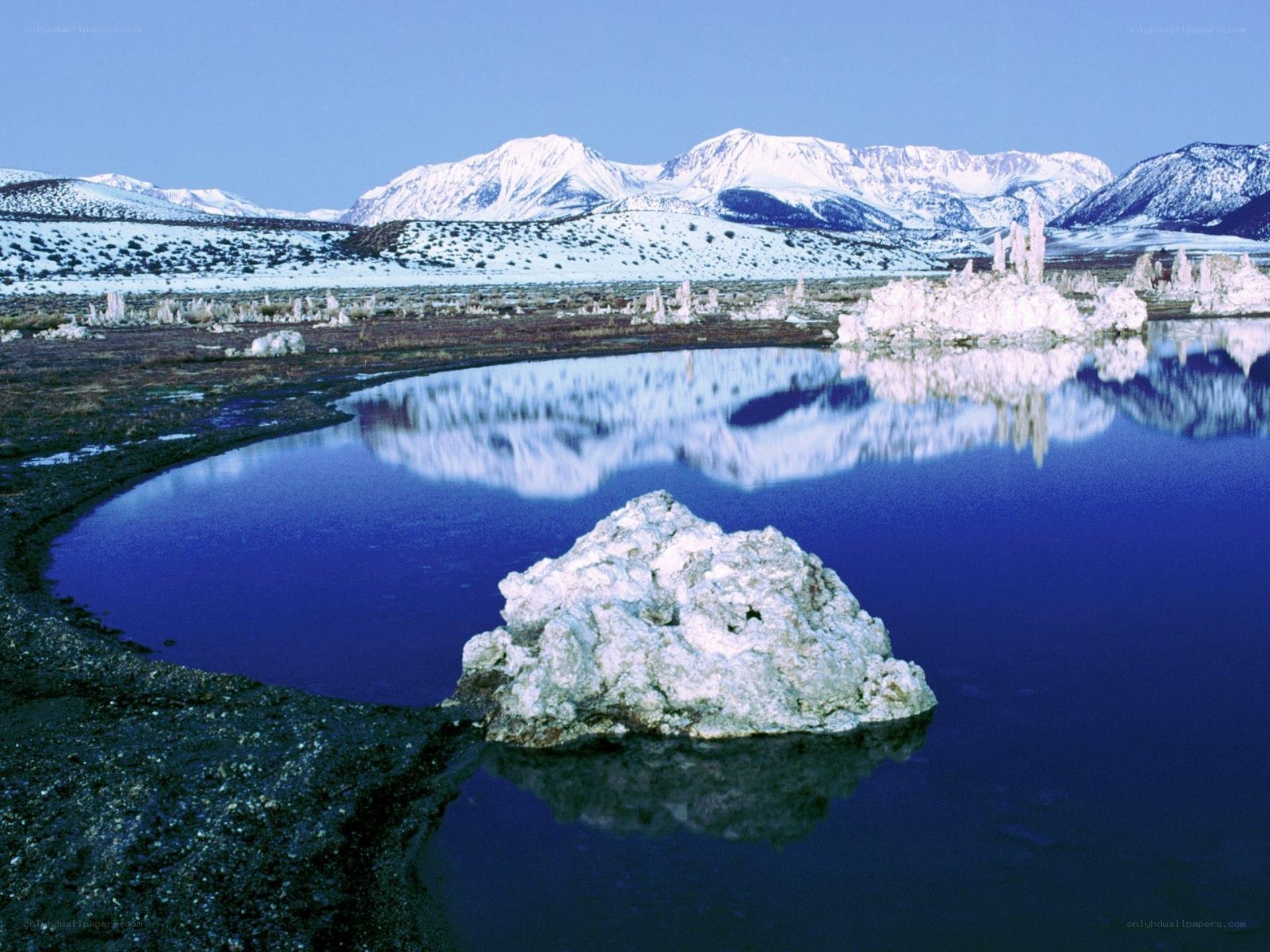 Snowy mountains and tufa formations