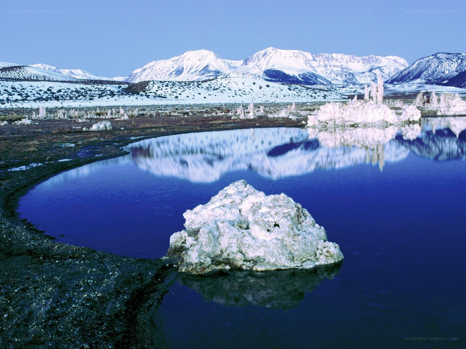 Snowy mountains and tufa formations