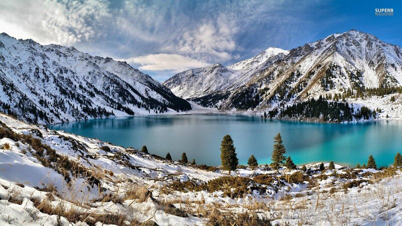 snowy mountains and turquoise lake