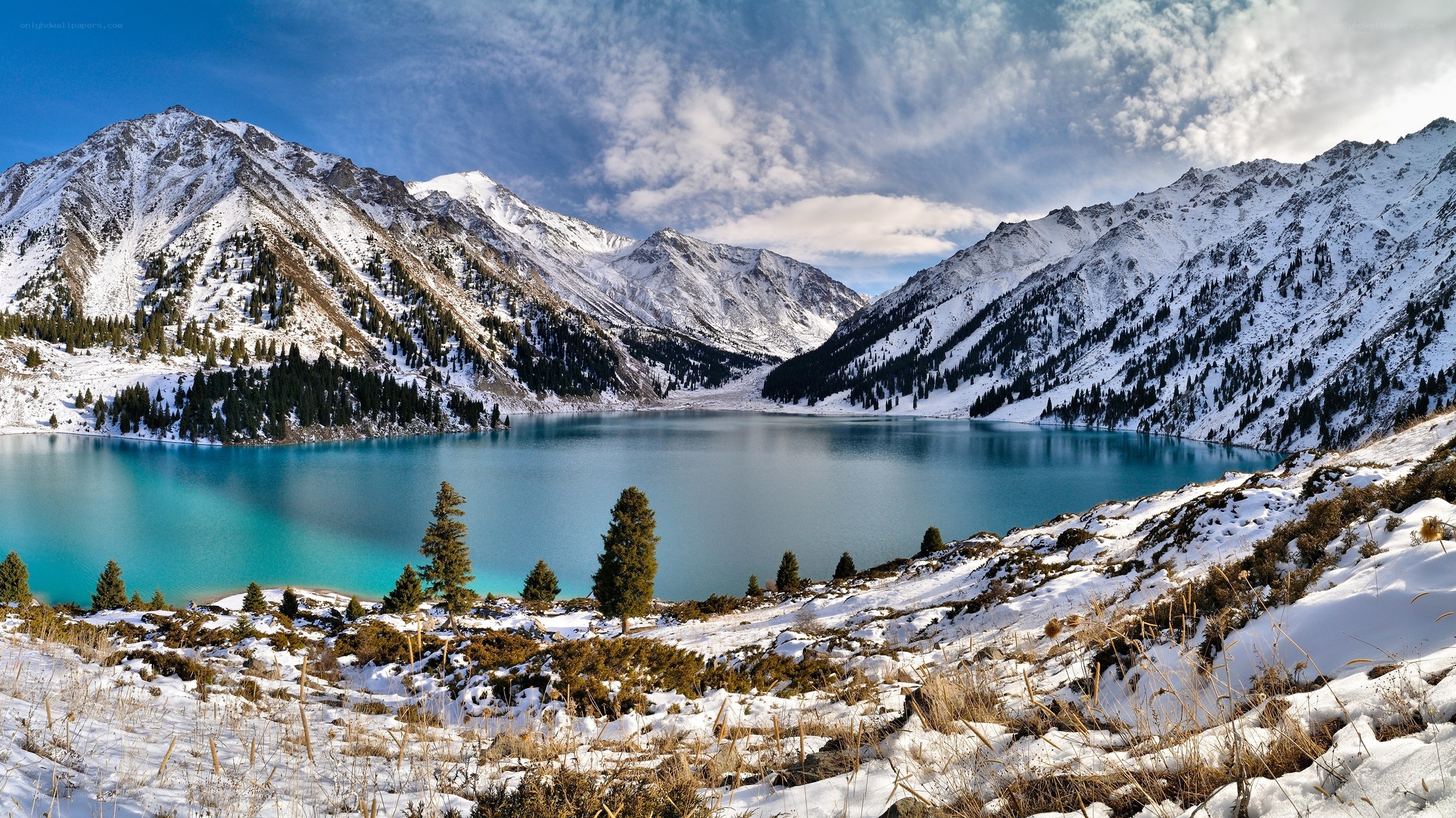 Snowy mountains and turquoise lake