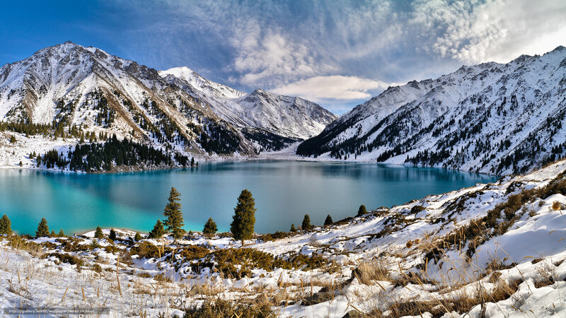 Snowy mountains and turquoise lake