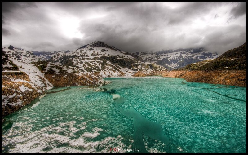 Snowy mountains and turquoise lake