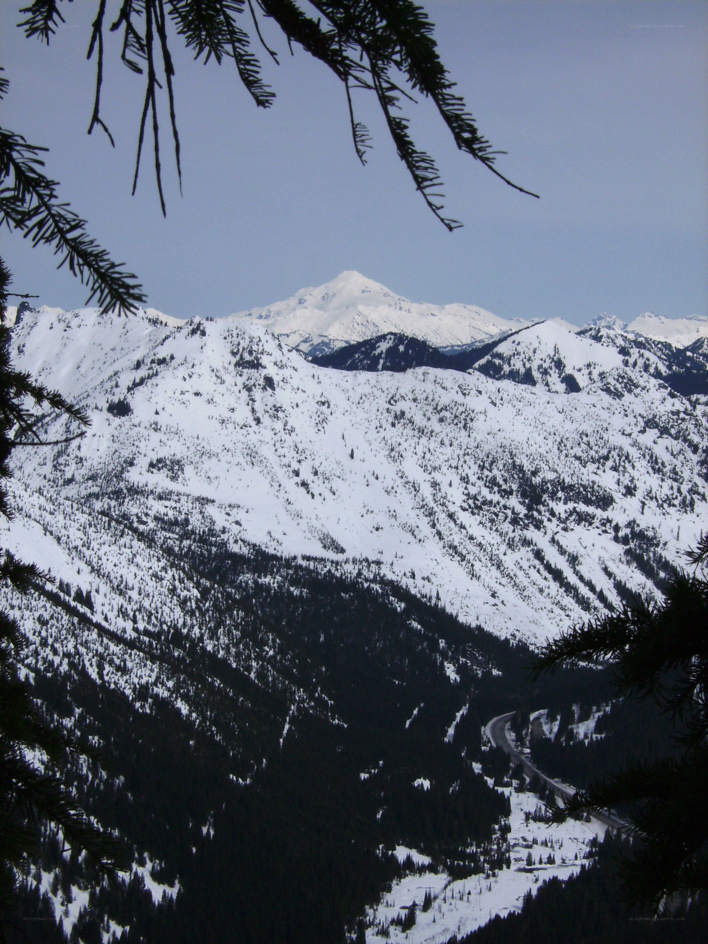 snowy mountains and winding road