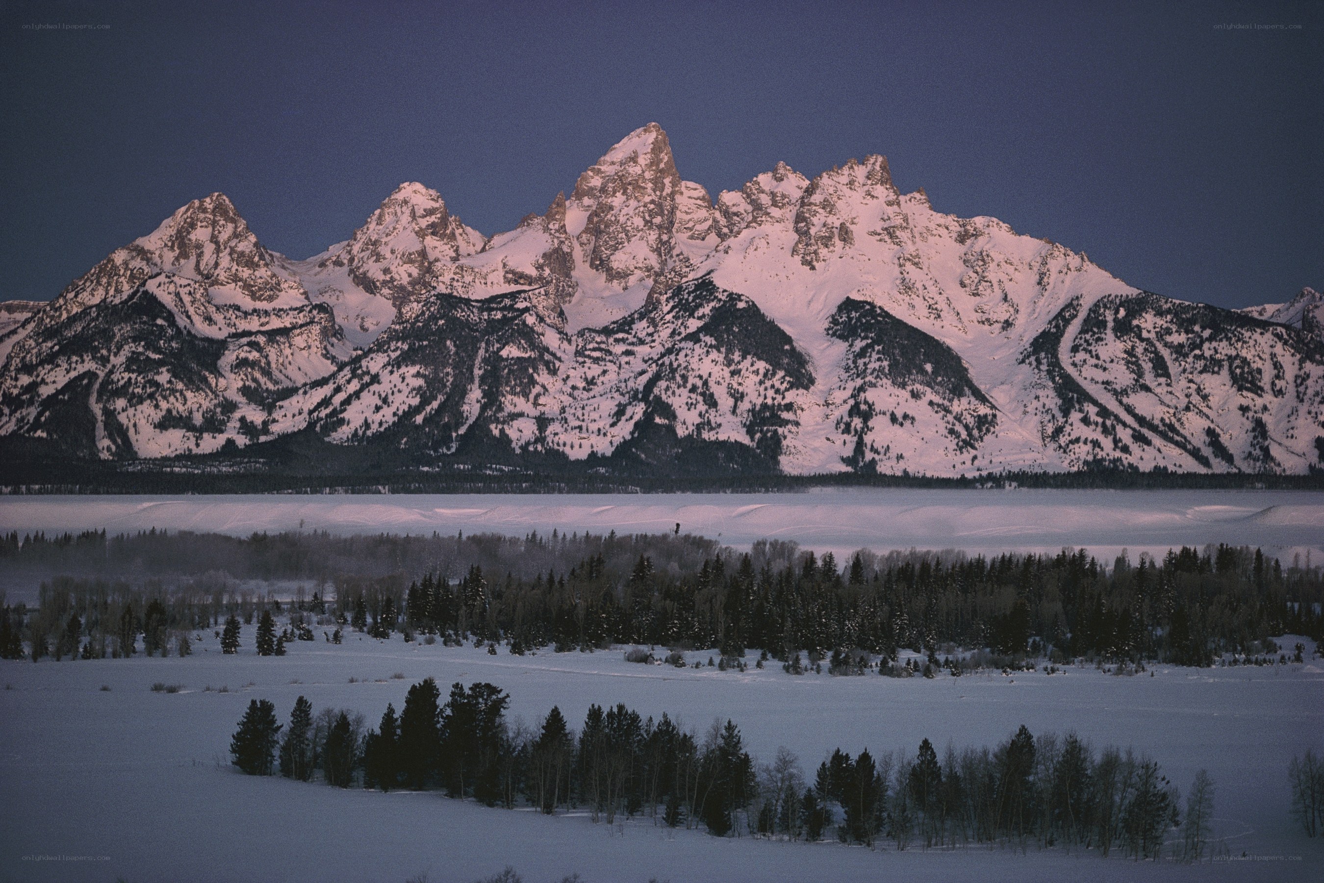 snowy mountains at dawn