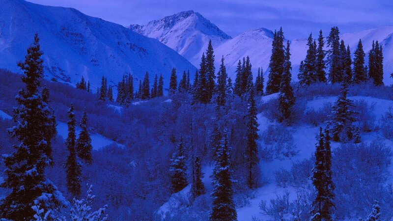 snowy mountains at dusk