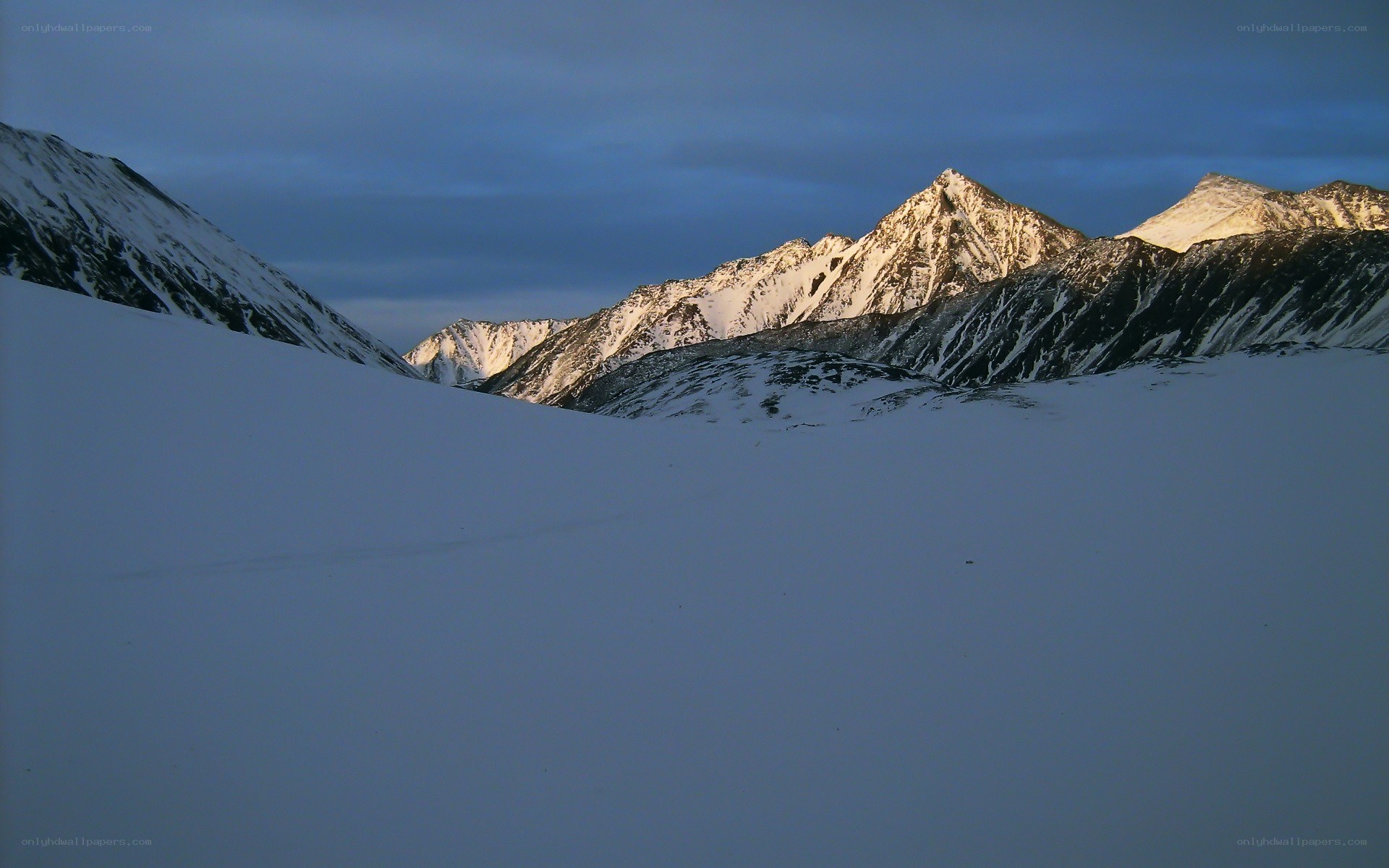 snowy mountains at dusk