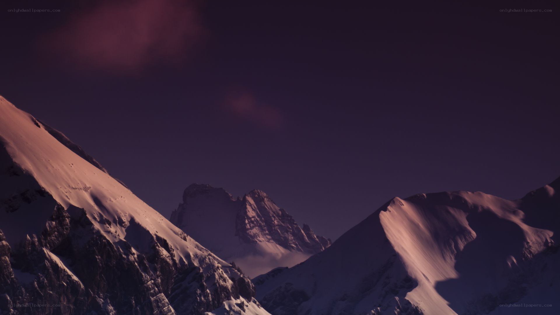 snowy mountains at dusk