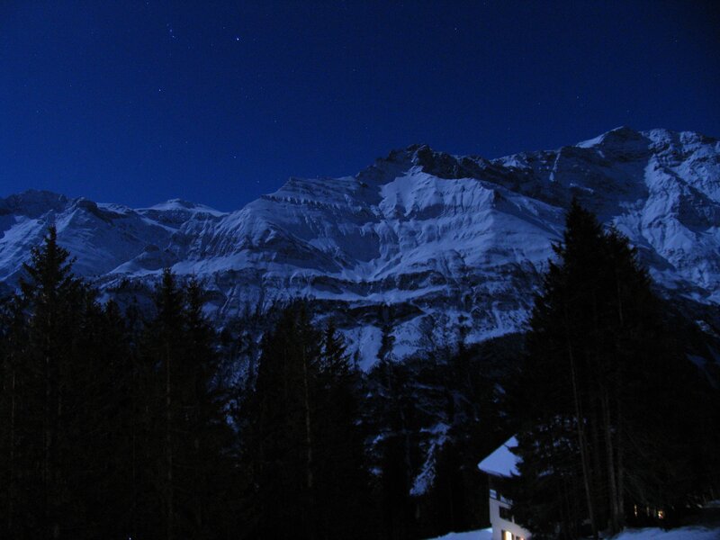 snowy mountains at night
