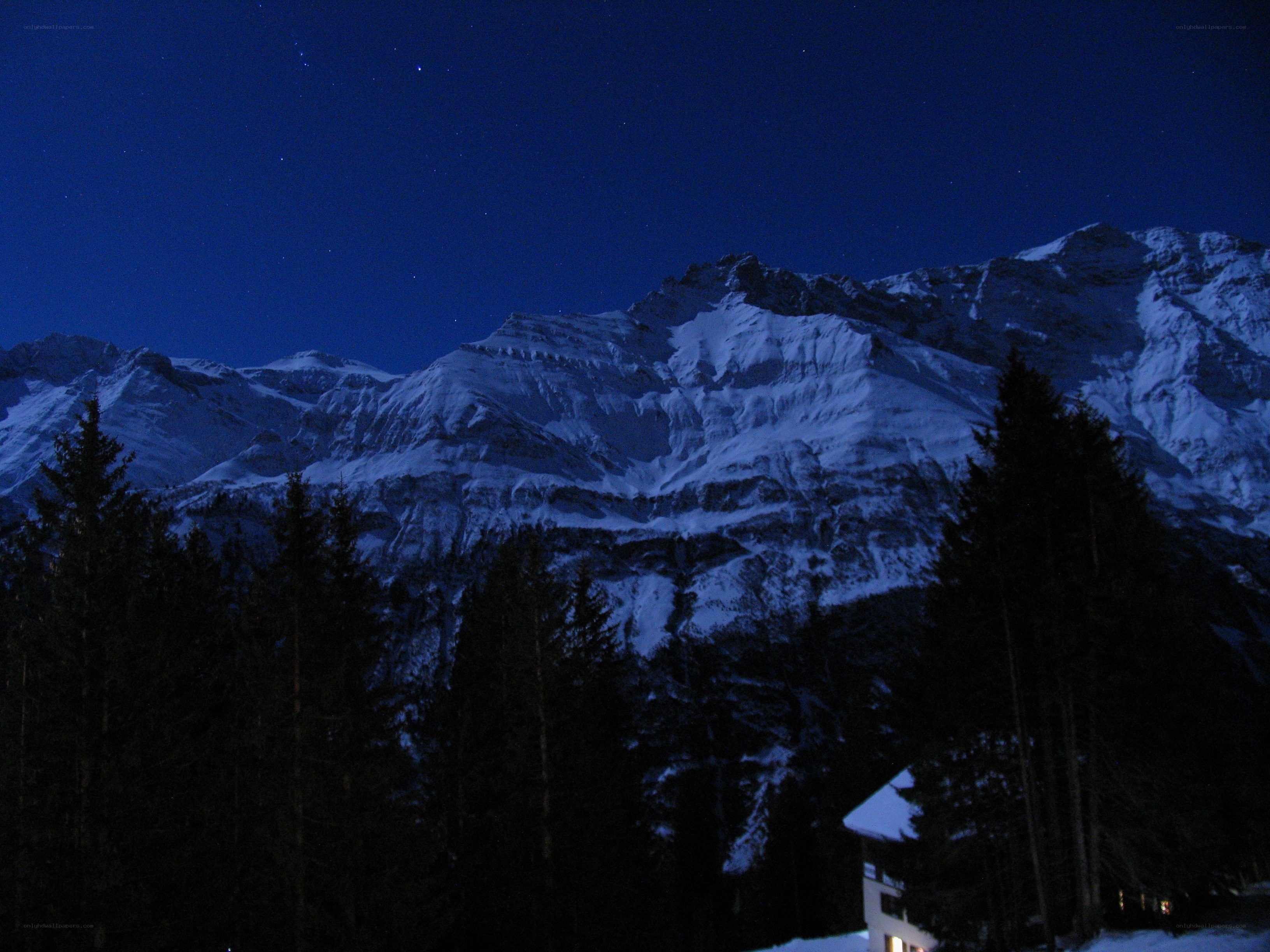 snowy mountains at night